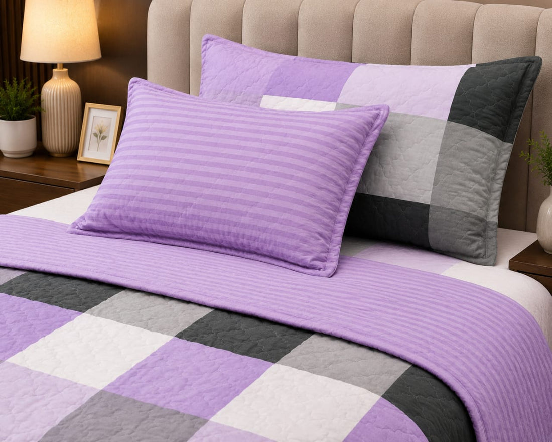 Lavender patchwork 4-piece comforter set on a styled bed with product details