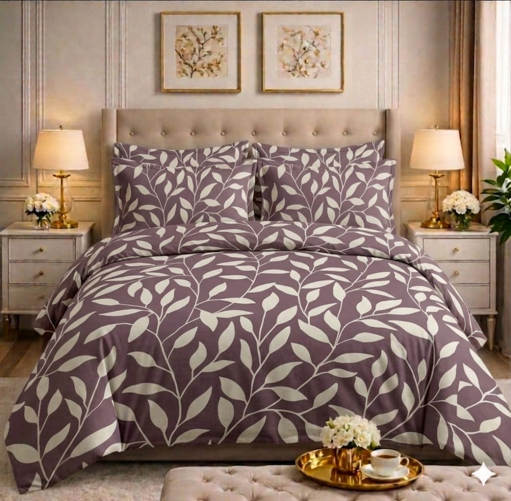 Mauve and cream botanical leaf comforter set on a styled bed