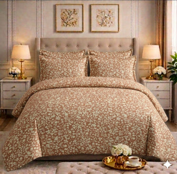 Mocha and cream floral comforter set on a styled bed