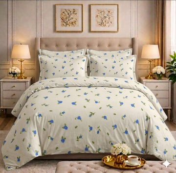 Blue rose floral comforter set on a styled bed