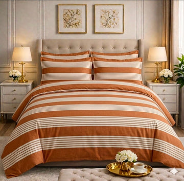 Terracotta and cream stripe comforter set on a styled bed